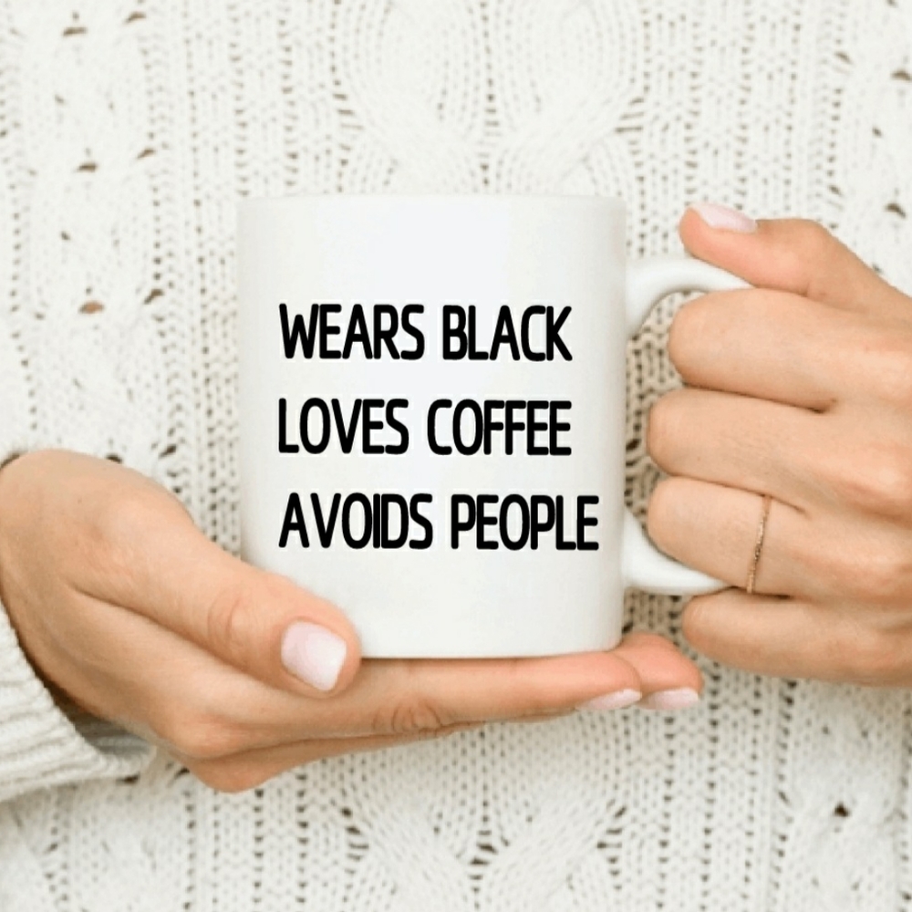 Wears black. Loves coffee. Avoids people. Mug